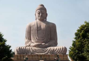 Pilgrims meditating at Mahabodhi Temple during the Bodh Gaya Buddhist Circuit Tour by Excellent Trip – a soulful Spiritual India Tour